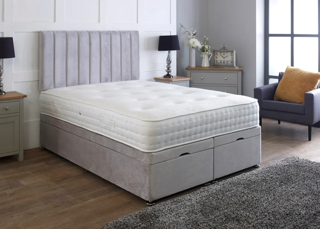 Apollo Ottoman Bed with dense vertical-lined headboard by Dreamcraft Furniture