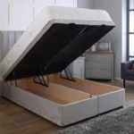 Apollo Ottoman Bed with dense vertical-lined headboard by Dreamcraft Furniture