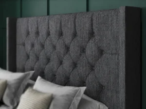 Chesterfield Ottoman Bed with diamond-tufted floor-standing wing headboard by Dreamcraft Furniture