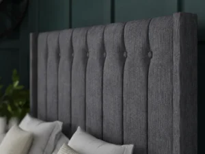 Florence Ottoman Bed with vertical-lined buttoned wing headboard by Dreamcraft Furniture