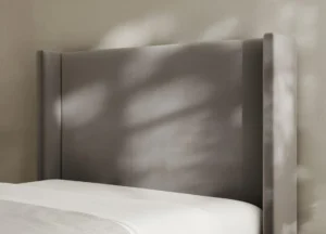 Jane Wingback Bed Frame featuring a tall minimalist headboard, subtle winged sides and a sleek, sophisticated design.