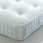 Apollo Ottoman Bed with dense vertical-lined headboard by Dreamcraft Furniture